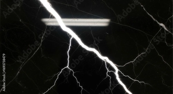 Fototapeta Dramatic image of a lightning bolt striking across a dark, marbled surface.
