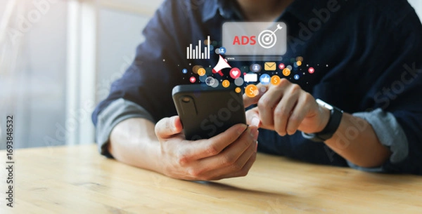 Fototapeta close up man use smartphone to check on virtual dashboard of ads marketing campaign for planning about reach target on website for business technology of search engine concept