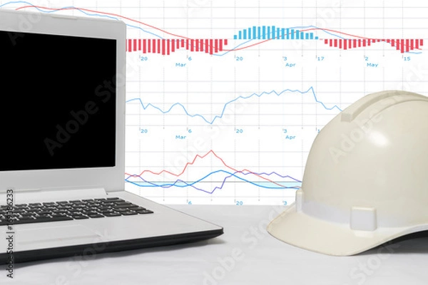 Fototapeta Engineers hats and laptop computers