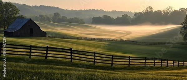 Fototapeta Golden dawn over undulating farmland with long shadows and morning dew