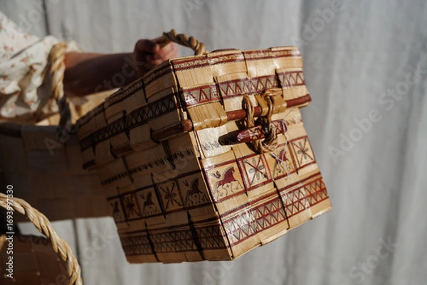 Fototapeta This handcrafted wooden basket showcases great artistry and skill in its intricate weaving