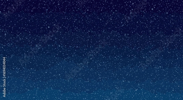 Fototapeta Delicate white snowflakes and snow particles falling on a dark navy blue gradient background.