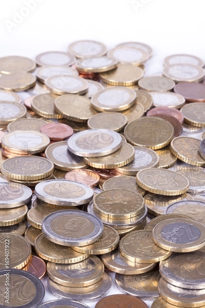 Obraz Many euro coins on white background.