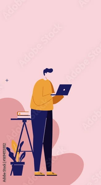 Fototapeta A young man, casually dressed, stands and works on his laptop in a modern, minimalist setting. Ideal for concepts of remote work, online learning, or digital lifestyle.