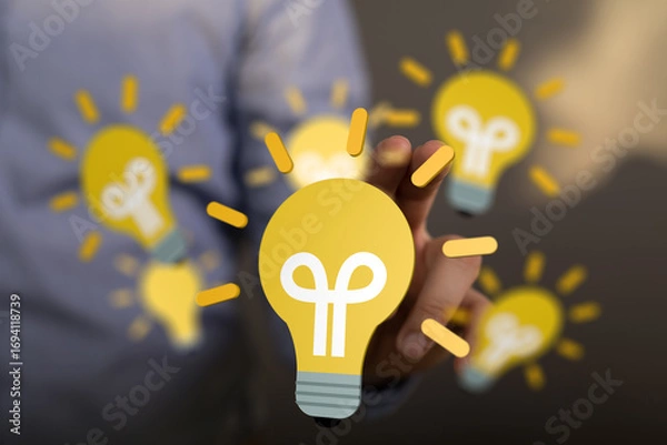 Fototapeta Person chooses a lightbulb, symbolizing innovation, creativity, and new ideas.
