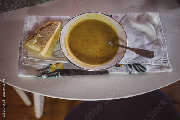 Obraz Homemade soup and a slice of homemade bread