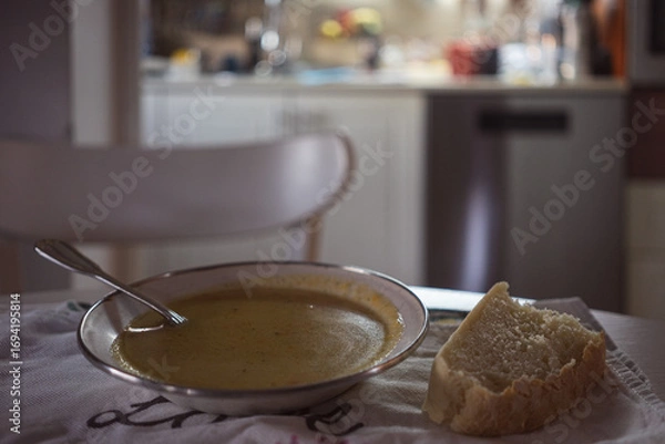 Obraz Homemade soup and a slice of homemade bread