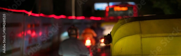 Fototapeta Indian Night Traffic Jam with Auto Rickshaw and Motorbikes in City Road Selective Focus Image with copyspace