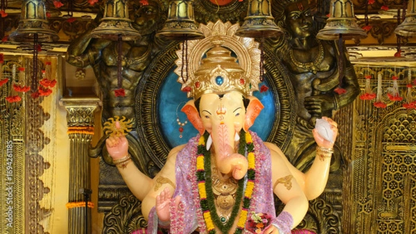 Fototapeta Lalbaugcha Raja Ganesh Statue with Golden Ornaments in Pandal