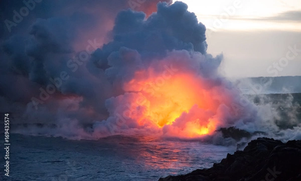 Fototapeta Lava flowing into ocean explosion eruption