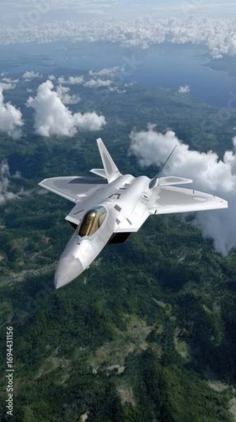 Fototapeta A high-performance aircraft soars gracefully above the clouds, showcasing advanced technology against a blue sky