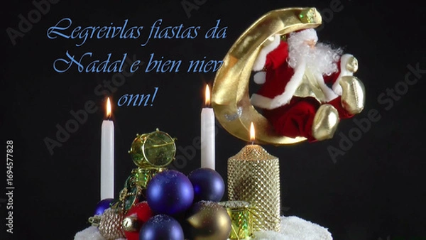 Fototapeta Warm Wishes for Christmas Joy 
A festive card with candles, baubles, and Santa Claus in the language Romanche 
