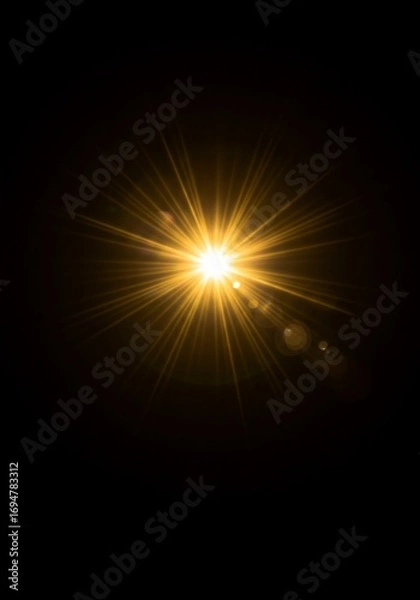 Obraz Golden Starburst Lens Flare on Black Background
