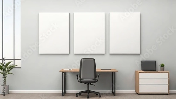 Fototapeta Blank triptych canvases on office wall above desk for mockup presentation