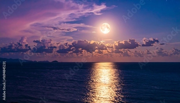 Fototapeta Full moon over a tranquil ocean at twilight