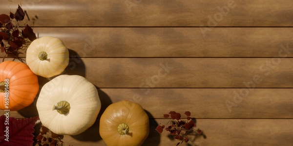 Obraz Autumn pumpkins and dried leaves on wooden background for fall decoration. 3d rendering