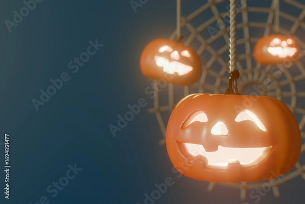 Obraz Halloween glowing jack-o-lanterns hanging on a spider web decoration. 3d rendering