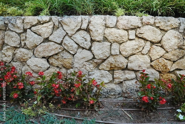 Obraz old stone wall with flowers