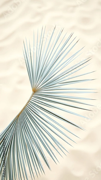 Obraz Minimalist White Palm Frond Pattern on Sandy Background vertical