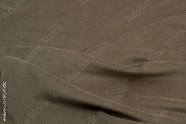 Fototapeta Fleece fabric green top view. Texture of textile fleece bedspread