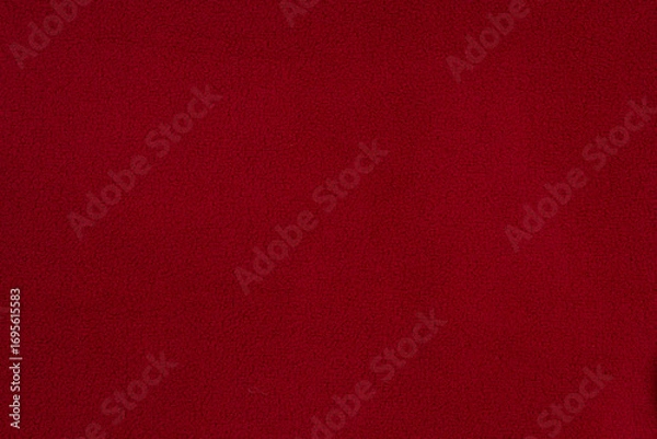 Fototapeta Fleece fabric red top view. Texture of textile fleece bedspread.