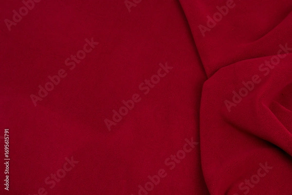 Fototapeta Fleece fabric red top view. Texture of textile fleece bedspread.