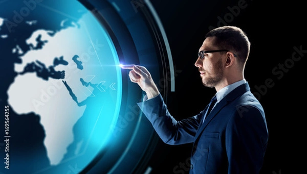 Fototapeta businessman with earth hologram over black