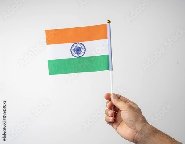 Fototapeta Hand Holding Small Indian Flag on White Background
