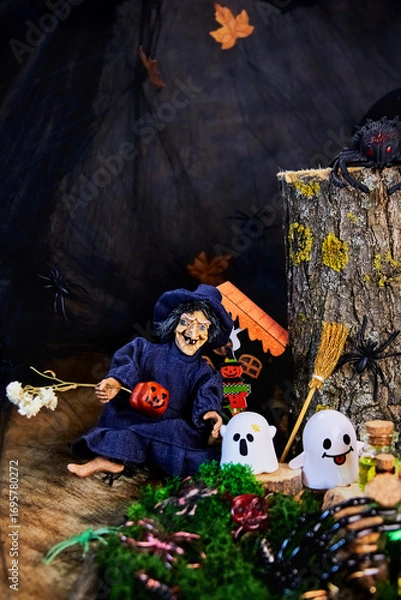 Fototapeta to a cheerful witch in cute ghosts came to visit the dark forest on All Saints Day, Halloween in cozy style