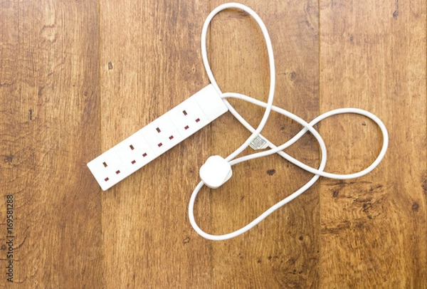 Fototapeta White UK power extension lead with multiple sockets