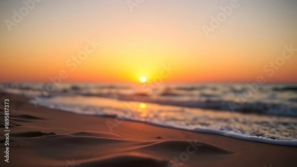 Obraz Serene beach sunset with golden tones and a softly focused horizon, creating a peaceful atmosphere.