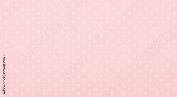 Fototapeta Delicate Polka Dot Pattern: Soft pink surface, adorned with evenly spaced white dots, offers a touch of vintage charm and timeless elegance, creating a delightful visual texture.