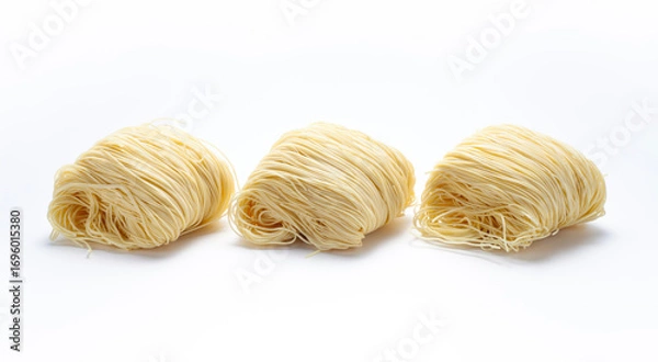 Obraz Three bunches of dried noodles on white background