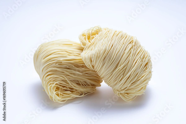 Obraz Two bunches of dried noodles on white background
