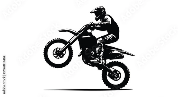 Fototapeta a motocross rider performing an impressive jump in silhouette