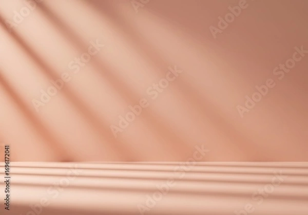 Fototapeta Warm peach background with soft diagonal light and shadow patterns
