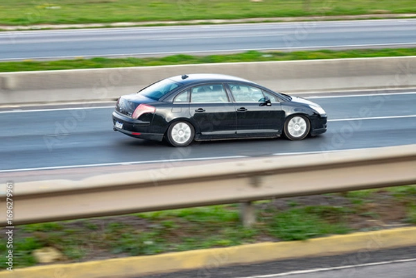 Fototapeta Driven by Precision: Sleek Motion on the Expressway