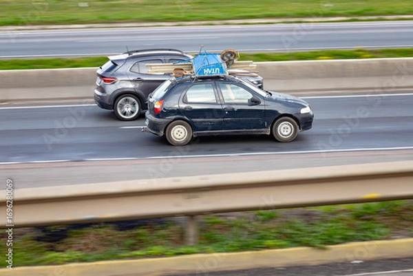 Fototapeta Loaded and Rolling: Street Survival in Style