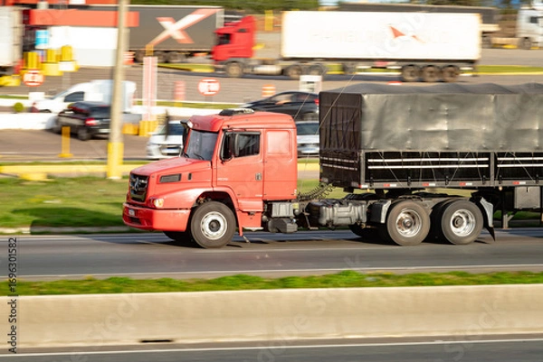 Fototapeta Heavy Duty Journey: Red Power on the Road
