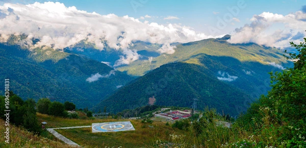 Fototapeta helipad high in the mountains in summer