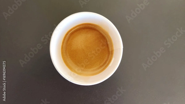 Fototapeta Top view of espresso coffee in a paper to-go cup