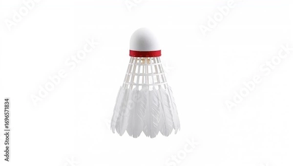 Fototapeta Close-up of a lone badminton birdie with white plumage and a red band on a clean white backdrop with plenty of empty space