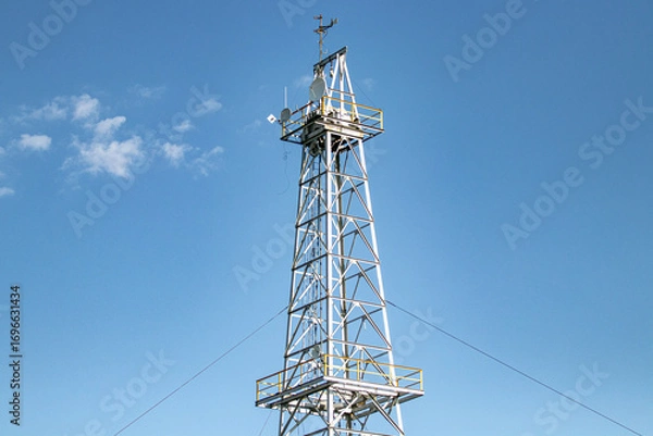 Fototapeta Metalic antenna receiver in front of clear sky 
