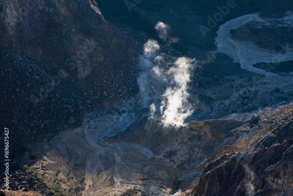 Fototapeta Geothermal Area With Steaming Earth In Rugged Mountainous Terrain