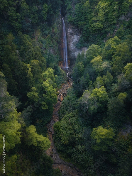 Obraz Majestic Waterfall in the Azores Surrounded by Lush Green Jungle – Aerial Drone View
