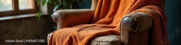 Fototapeta Cozy warm wool throw blanket draped over a rustic wooden armchair indoors, creating a comfortable and inviting atmosphere Perfect for autumn or winter scenes , yarn, detail, chair