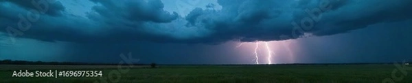 Fototapeta Dramatic dark clouds building over a vast landscape, heavy rain imminent, lightning strikes in the distance A powerful and moody nature scene , landscape, dramatic