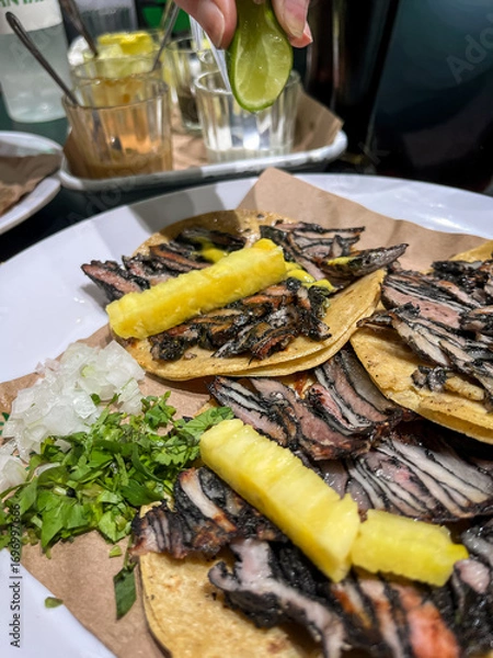 Obraz Gourmet black pastor tacos with pineapple and lime squeeze