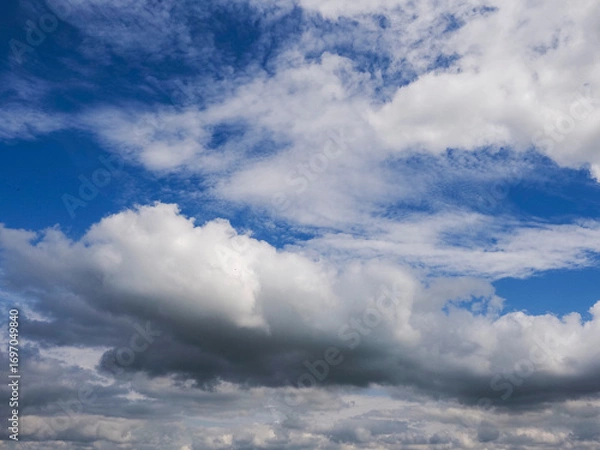 Fototapeta Blue cloudy sky. Nature background for design. Cloudscape.