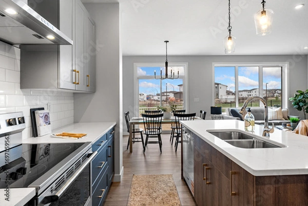 Fototapeta Kitchen with a large island and a dining table